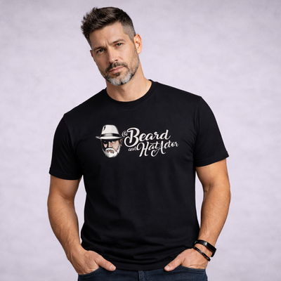 Man wearing a black t-shirt with a graphic and text on a gray background