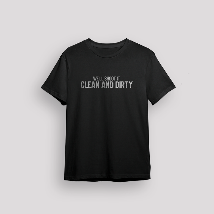 Flatlay of a black 100% cotton t-shirt from Beard and Hat Actor with the phrase “WE’LL SHOOT IT CLEAN AND DIRTY” printed in light gray across the chest