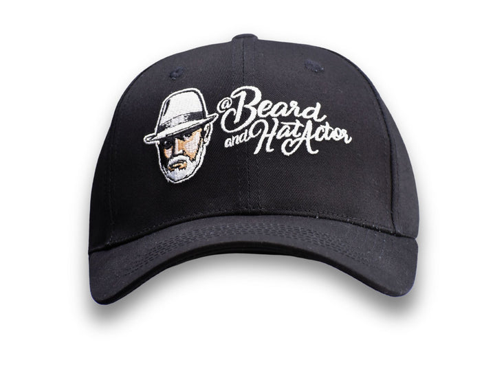 Front view of a black 6-panel structured snapback baseball cap with a curved bill, featuring the embroidered Beard and Hat Actor logo on the front